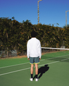 View of model wearing Lucent White Racquet Club Collared Sweatshirt, Relaxed Fit.