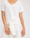 View of model wearing Lucent White Women's Deep V-Neck Tee Shirt.