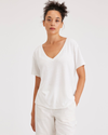 Front view of model wearing Lucent White Women's Deep V-Neck Tee Shirt.