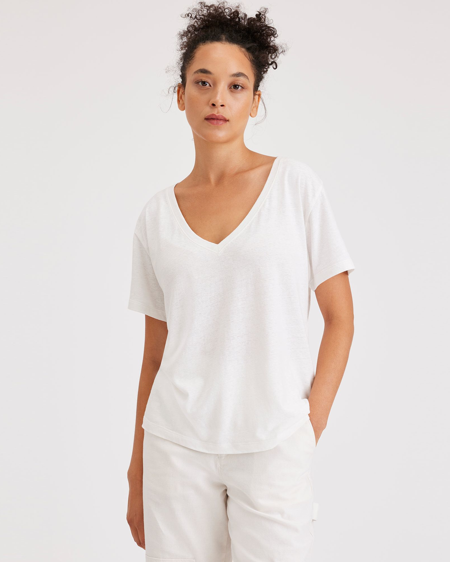 Front view of model wearing Lucent White Women's Deep V-Neck Tee Shirt.
