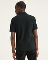 Back view of model wearing Mineral Black Pique Polo, Slim Fit.