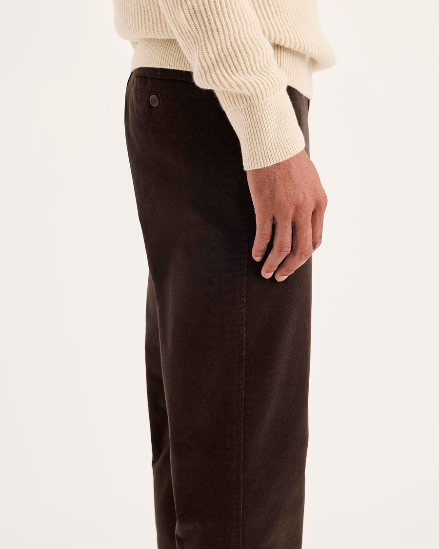 Side view of model wearing Mole Ultimate Chinos, Slim Fit.
