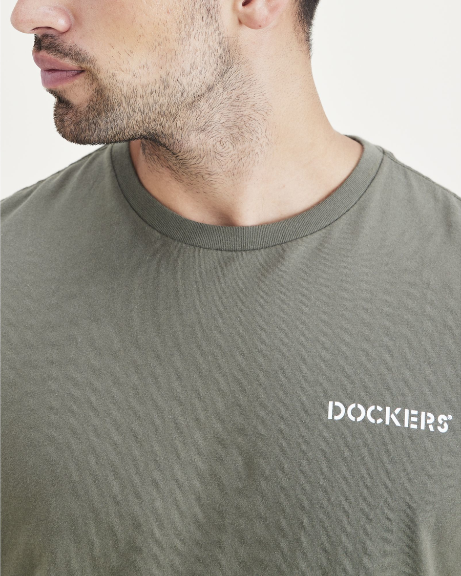 View of model wearing Mottled Green Men's Slim Fit Logo Tee.