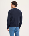 Back view of model wearing Navy Blazer Crafted Cashmere Sweater, Regular Fit.