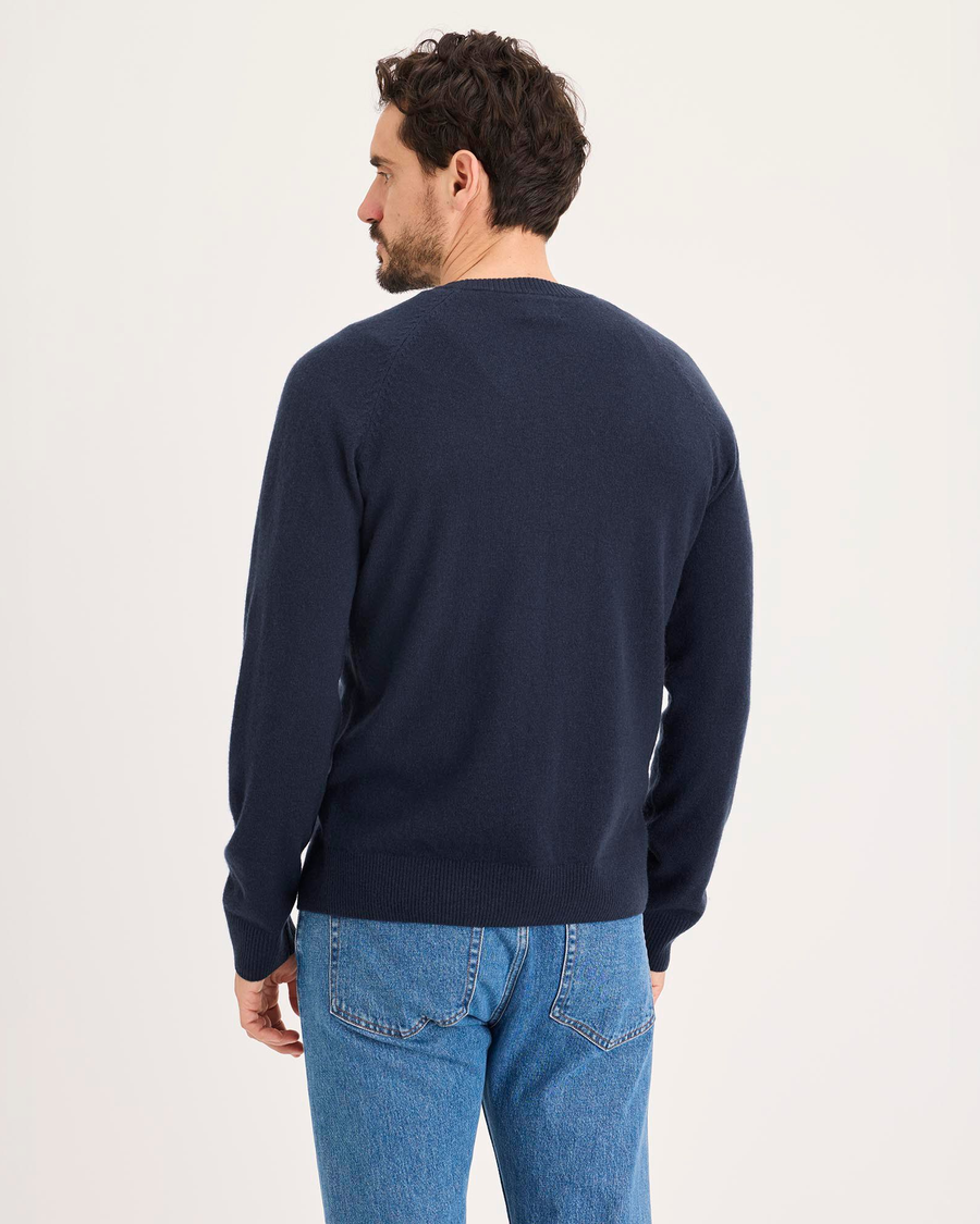 Back view of model wearing Navy Blazer Crafted Cashmere Sweater, Regular Fit.