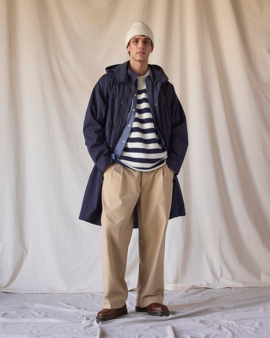 View of model wearing Navy Blazer Dockers® x Transnomadica Squall Coat.