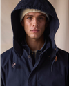 View of model wearing Navy Blazer Dockers® x Transnomadica Squall Coat.
