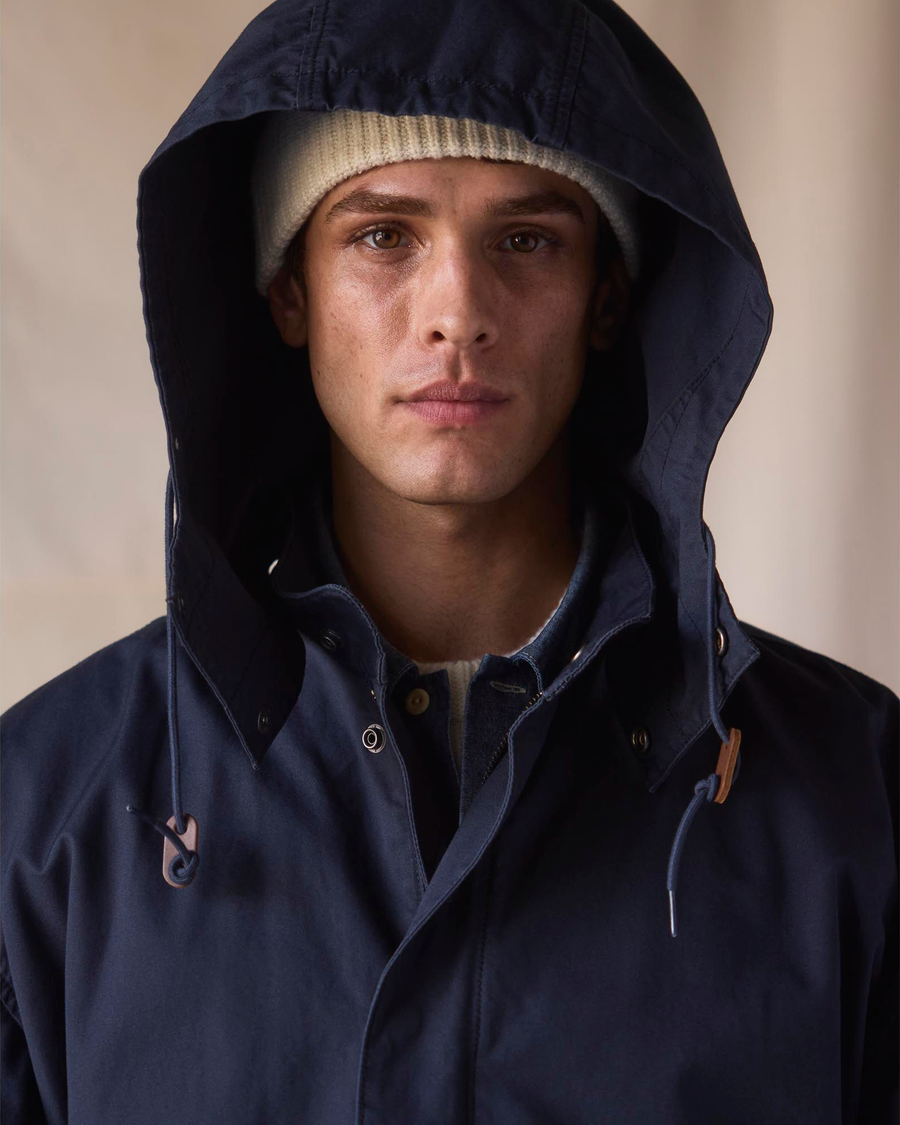 View of model wearing Navy Blazer Dockers® x Transnomadica Squall Coat.