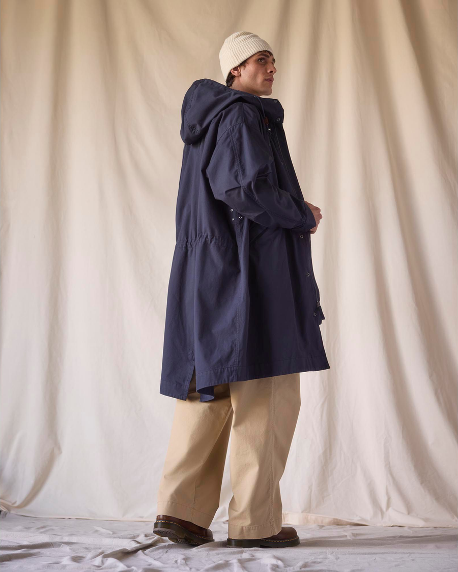 Back view of model wearing Navy Blazer Dockers® x Transnomadica Squall Coat.