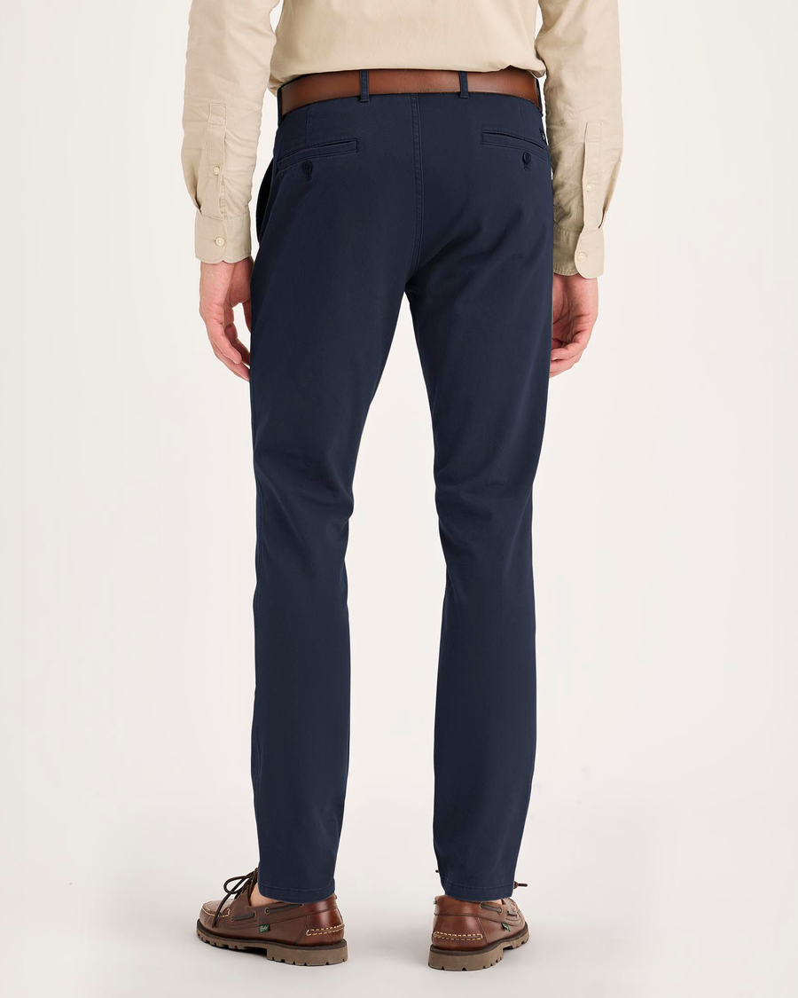 Back view of model wearing Navy Blazer Essential Chino Pants, Skinny Fit.