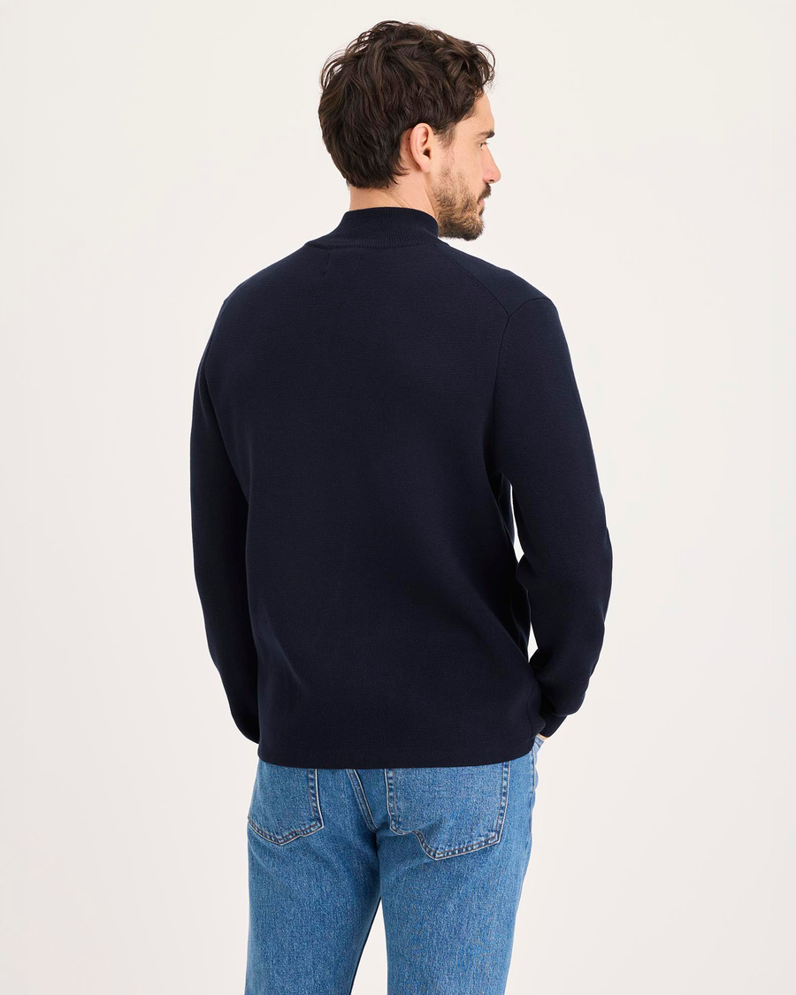 Back view of model wearing Navy Blazer Full-Zip Sweater, Regular Fit.