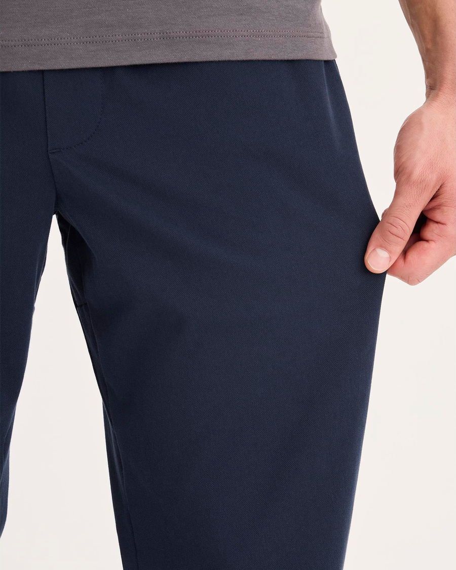 View of model wearing Navy Blazer Go Activeflex Pull-On Pant, Slim Fit.