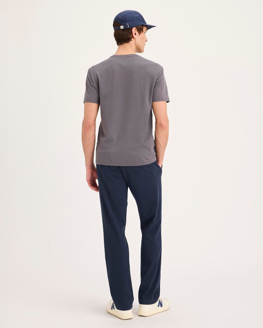 Back view of model wearing Navy Blazer Go Activeflex Pull-On Pant, Slim Fit.