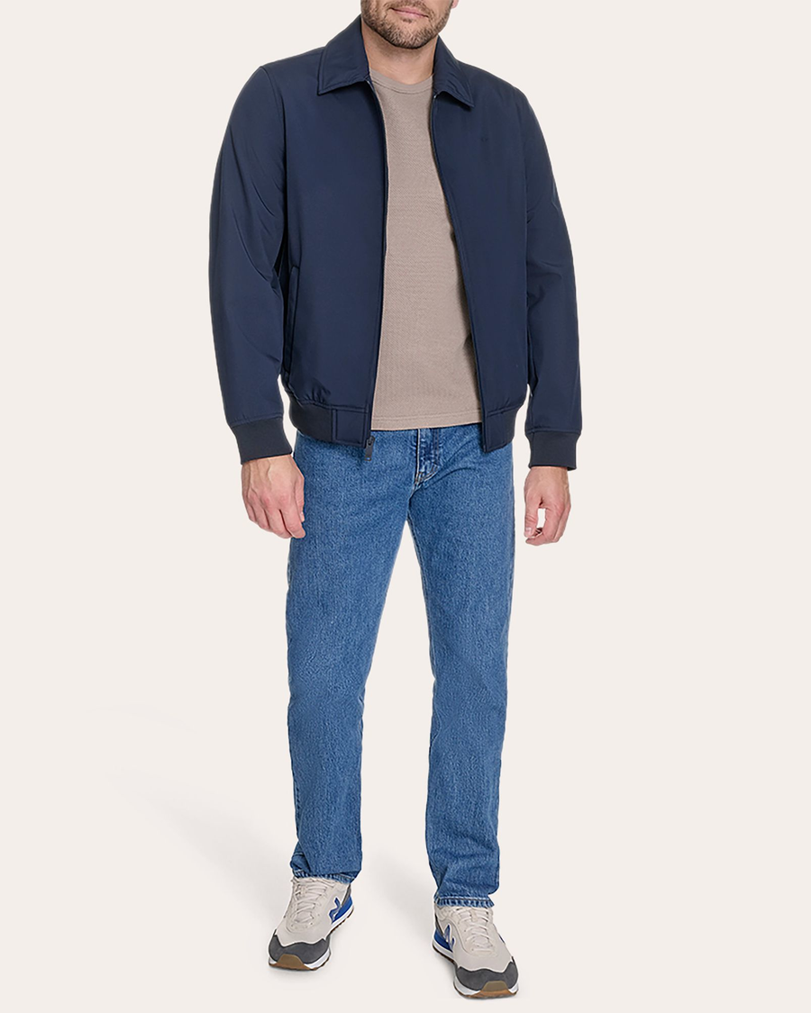 View of model wearing Navy Blazer Go Golf Bomber.