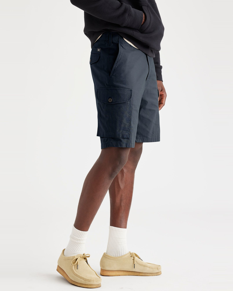 Side view of model wearing Navy Blazer Men's Cargo Shorts.