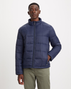 Front view of model wearing Navy Blazer Men's Nylon Lightweight Quilted Jacket.