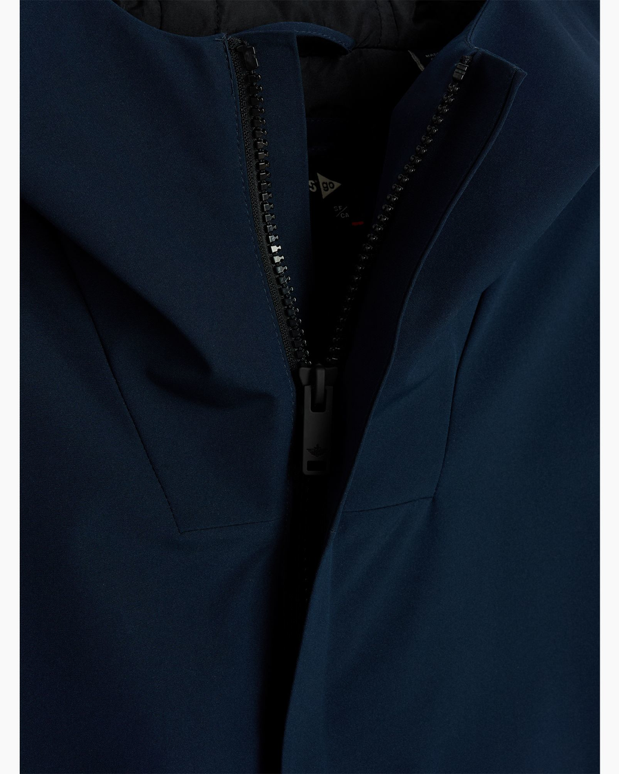 View of model wearing Navy Blazer Men's Performance Welded Modern Parka Jacket.