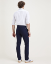 Back view of model wearing Navy Blazer Men's Skinny Fit Original Chino Pants.