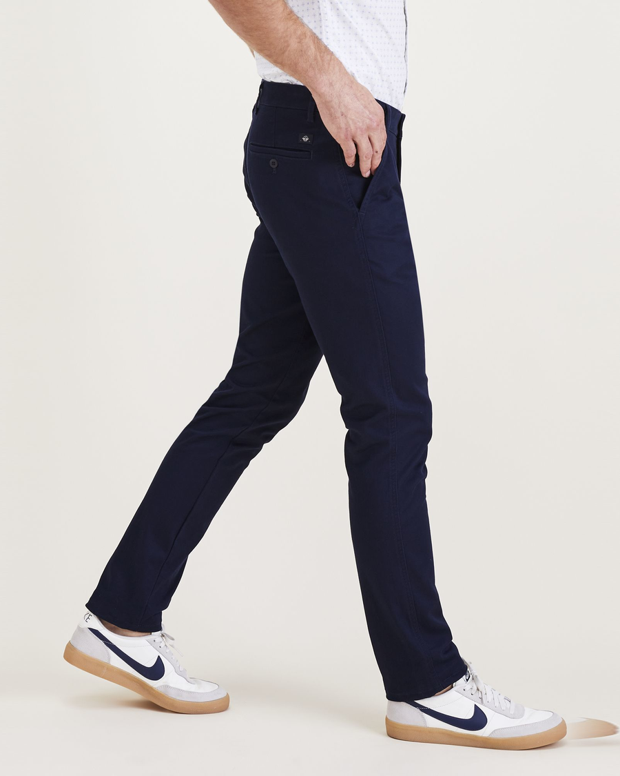 Side view of model wearing Navy Blazer Men's Skinny Fit Original Chino Pants.