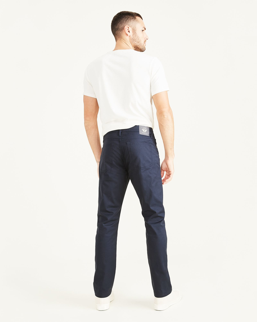 Back view of model wearing Navy Blazer Men's Slim Fit Smart 360 Flex Jean Cut Pants.