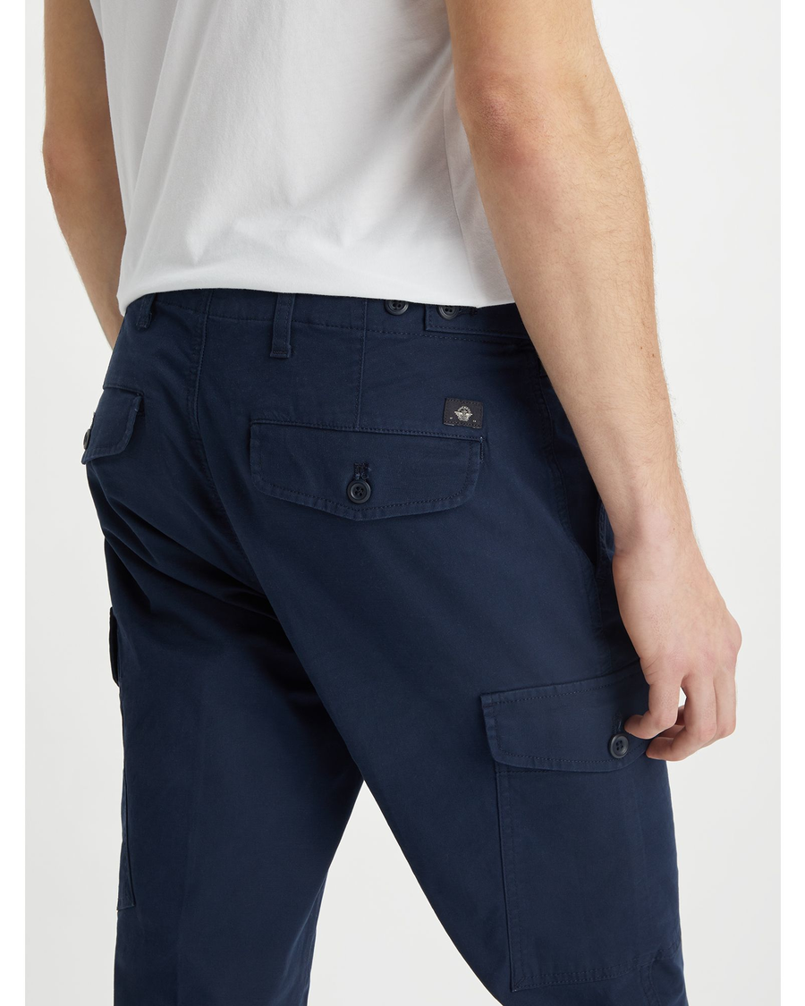 View of model wearing Navy Blazer Men's Slim Tapered Fit Cargo Pants.