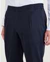 View of model wearing Navy Blazer Men's Slim Tapered Fit Refined Pull-On Pants.