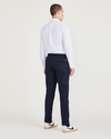 Back view of model wearing Navy Blazer Men's Slim Tapered Fit Refined Pull-On Pants.