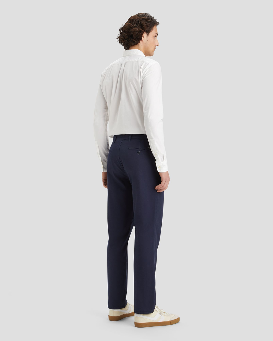 Back view of model wearing Navy Blazer Men's Straight Fit Original Chino Pants.