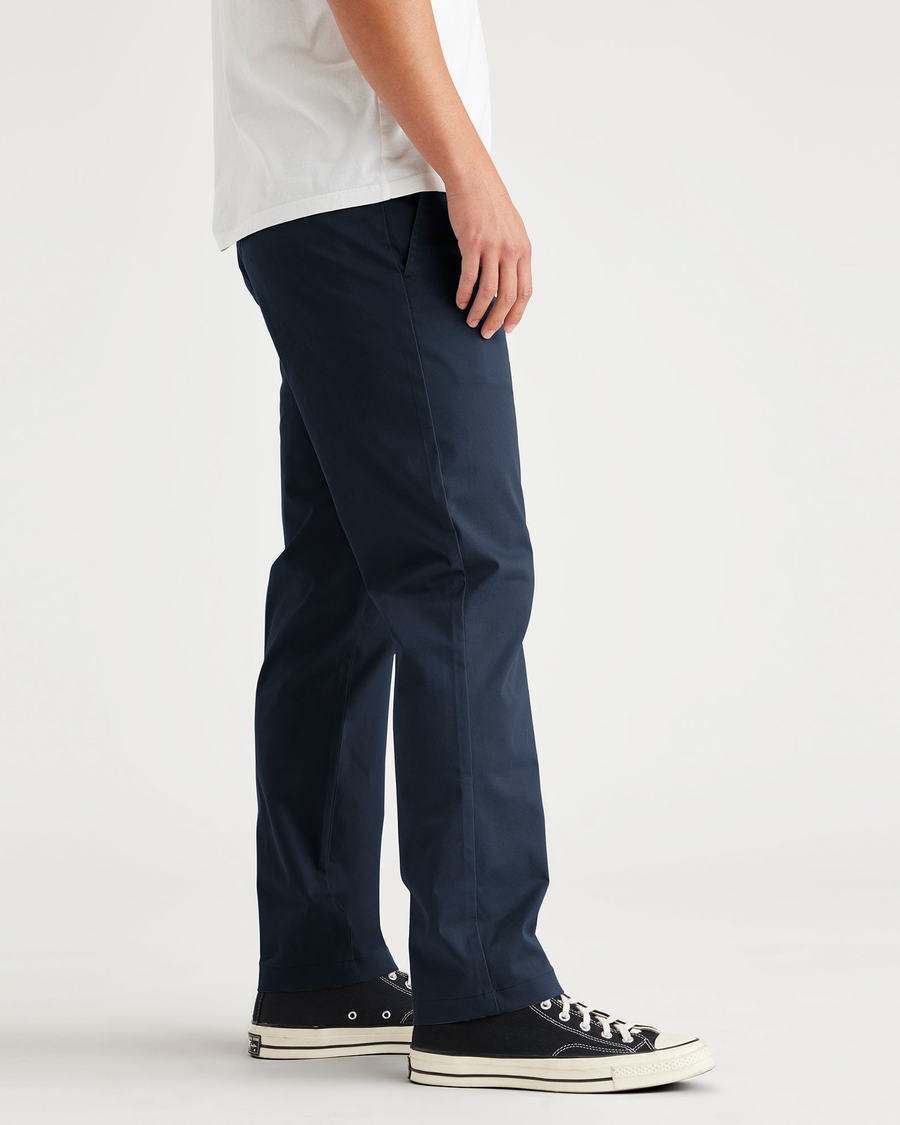 Side view of model wearing Navy Blazer Original Chino, Slim Fit.