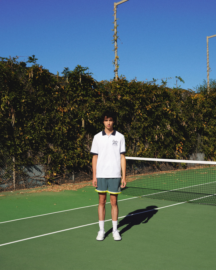 View of model wearing Navy Blazer Racquet Club Polo, Regular Fit.