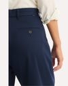 View of model wearing Navy Blazer Signature Iron Free Khakis, High Wide with Stain Defender®.