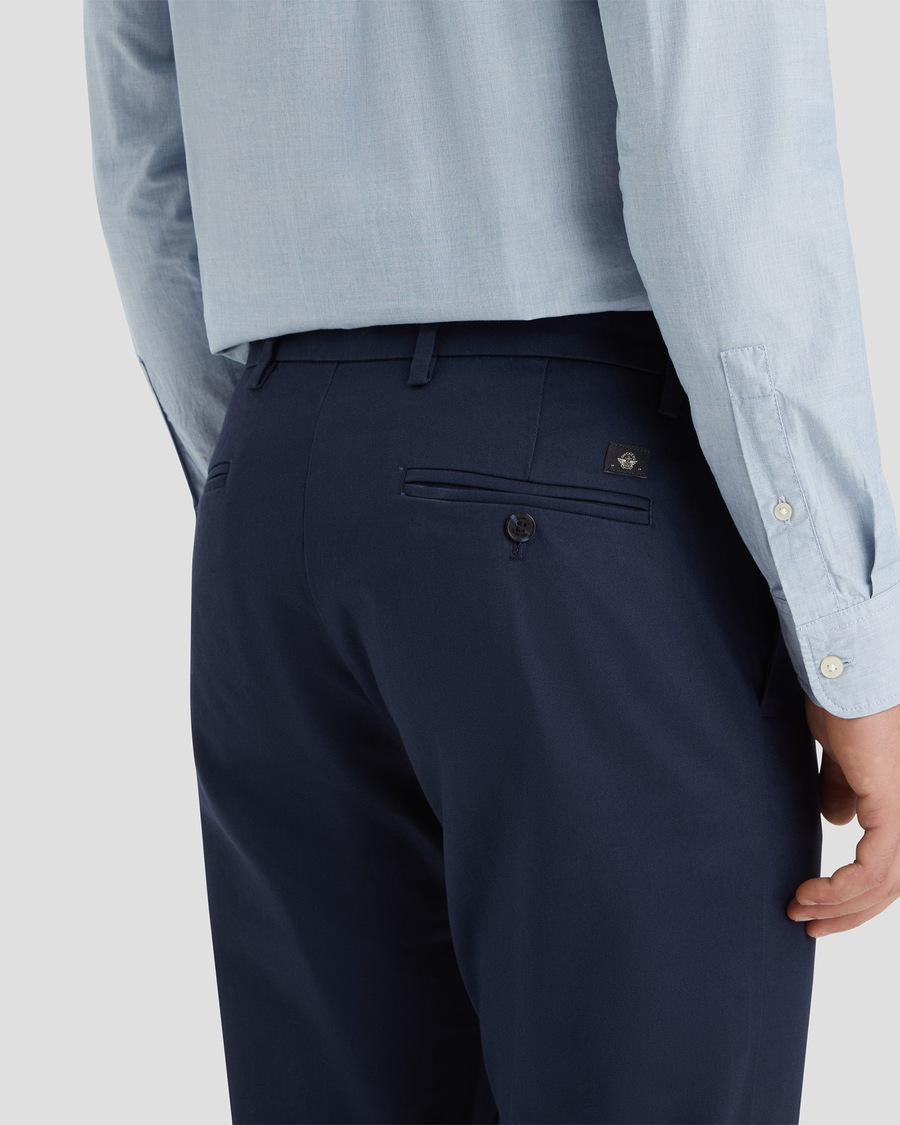 View of model wearing Navy Blazer Signature Iron Free Khakis, Slim Fit with Stain Defender®.