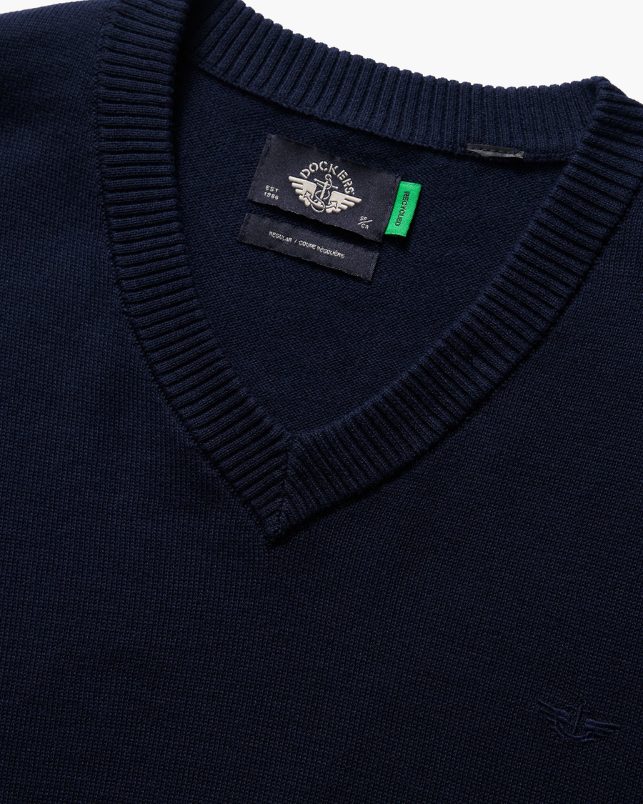 View of model wearing Navy Blazer V Neck Sweater.