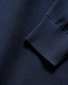 View of model wearing Navy Blazer V Neck Sweater.