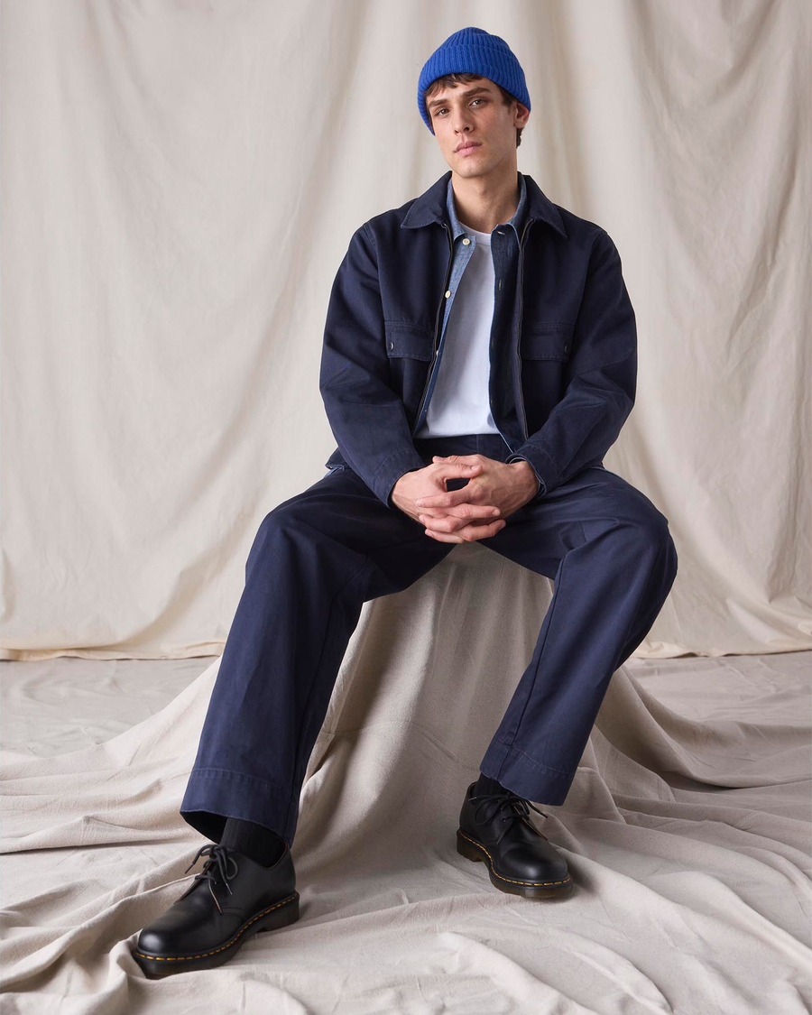 View of model wearing Navy Blue Dockers® x Transnomadica Mechanics Jacket.