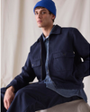 Front view of model wearing Navy Blue Dockers® x Transnomadica Mechanics Jacket.