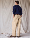 Back view of model wearing New British Khaki Dockers® x Transnomadica Rigger Pant.