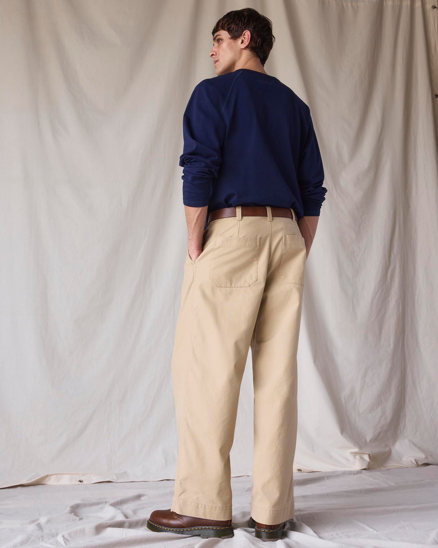 Back view of model wearing New British Khaki Dockers® x Transnomadica Rigger Pant.