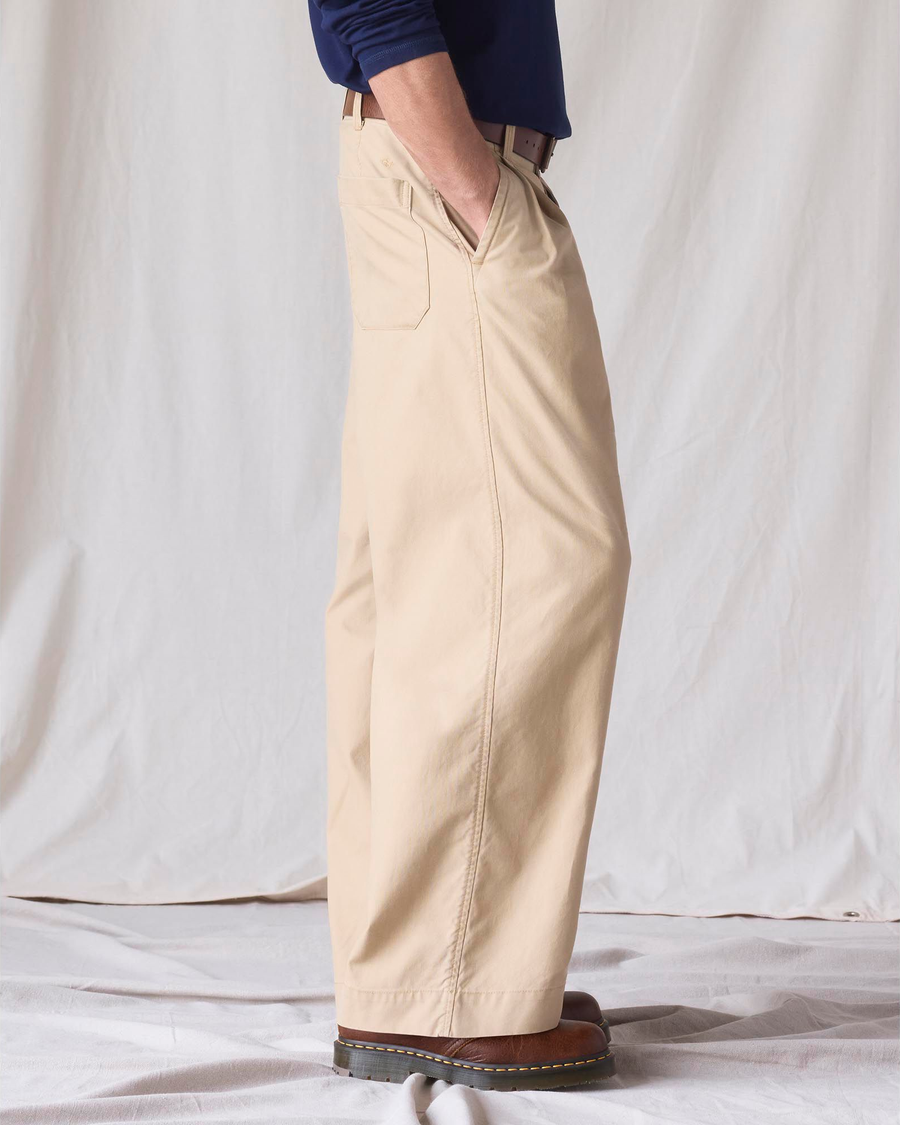 Side view of model wearing New British Khaki Dockers® x Transnomadica Rigger Pant.