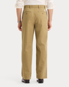 Back view of model wearing New British Khaki Eighty-Six Original Chino Pants, Loose Fit.