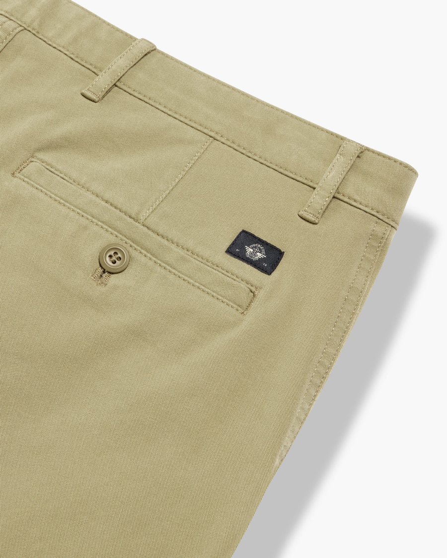 View of model wearing New British Khaki Essential Chino Pants, Slim Fit.