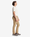 Side view of model wearing New British Khaki Men's Skinny Fit Smart 360 Flex Alpha Khaki Pants.