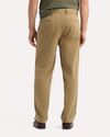Back view of model wearing New British Khaki Original Chino Pants, Relaxed Taper Fit.