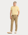 View of model wearing New British Khaki Original Chino Pants, Slim Fit.