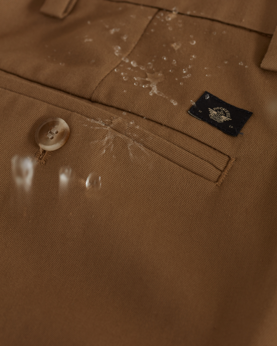 View of model wearing New British Khaki Signature Iron Free Khakis, Creased, Slim Fit with Stain Defender®.