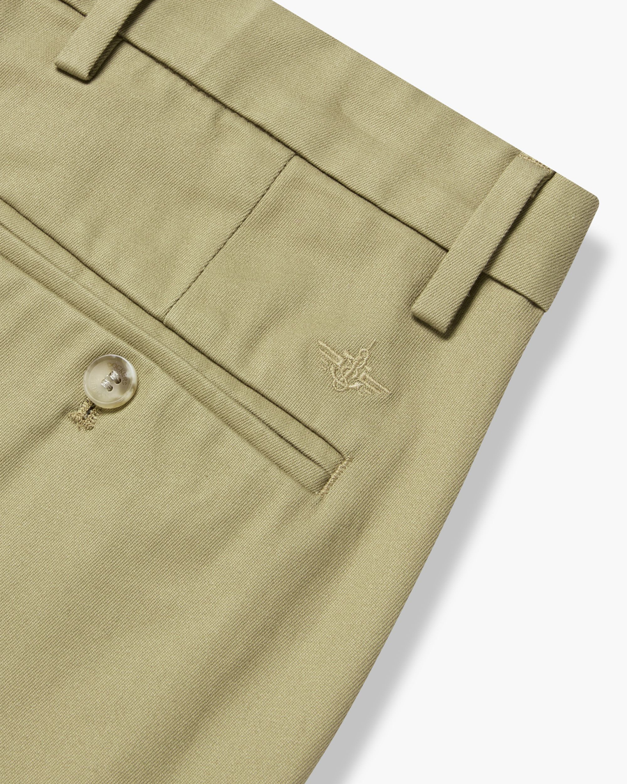 View of model wearing New British Khaki Signature Iron Free Khakis, Skinny Fit with Stain Defender®.