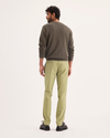 Back view of model wearing New British Khaki Signature Iron Free Khakis, Skinny Fit with Stain Defender®.