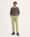 Front view of model wearing New British Khaki Signature Iron Free Khakis, Skinny Fit with Stain Defender®.