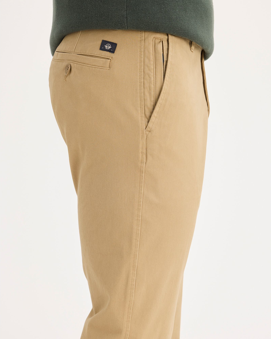 Side view of model wearing New British Khaki Ultimate Chinos, Slim Fit.