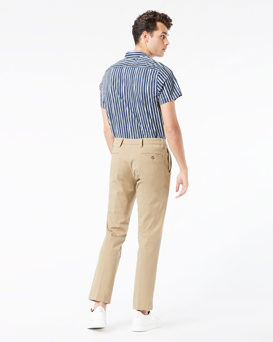Back view of model wearing New British Khaki Workday Khaki Pants, Slim Fit.